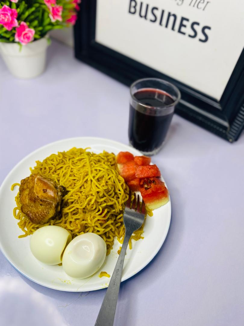 Nigerian-style noodles with eggs, chicken, and plantain