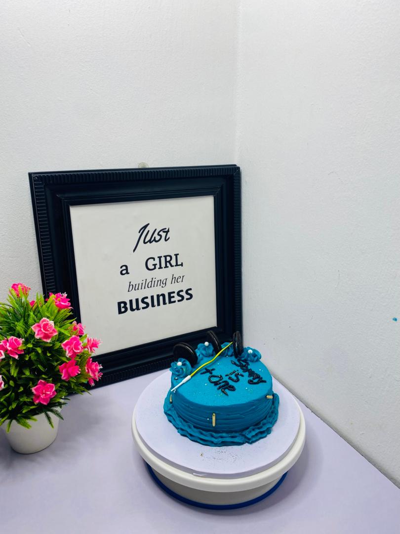 Blue celebration cake with decorative text