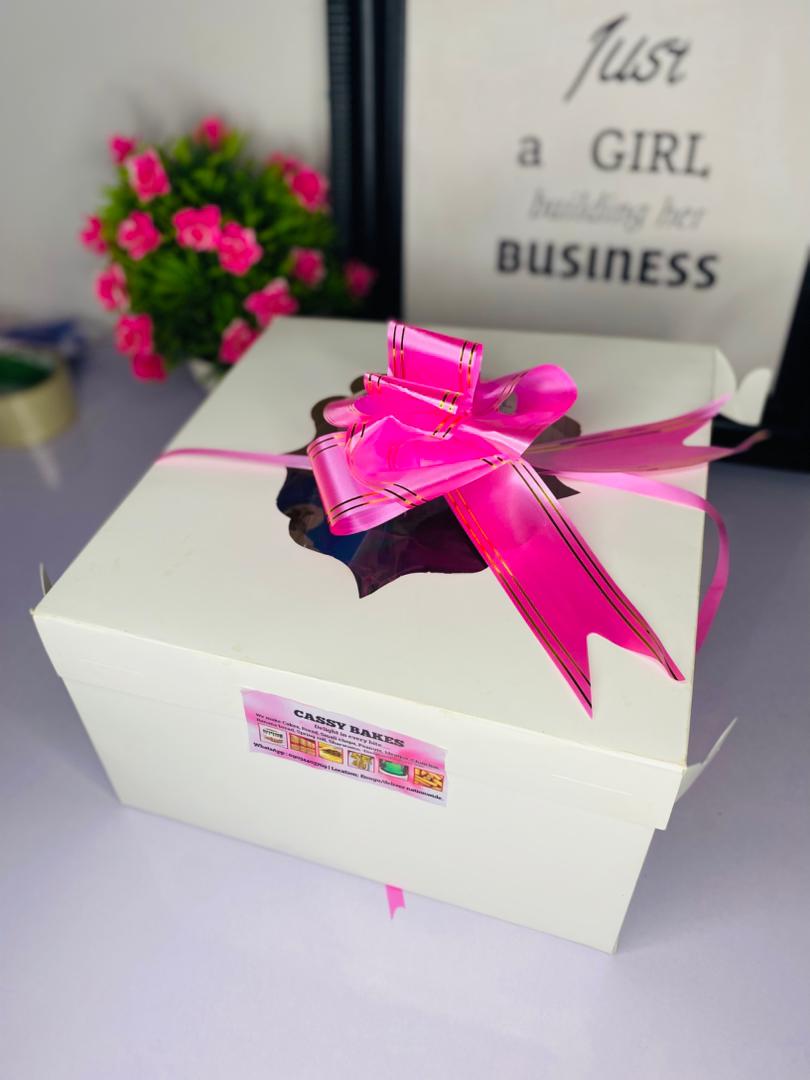 Gift box packaging with pink ribbon